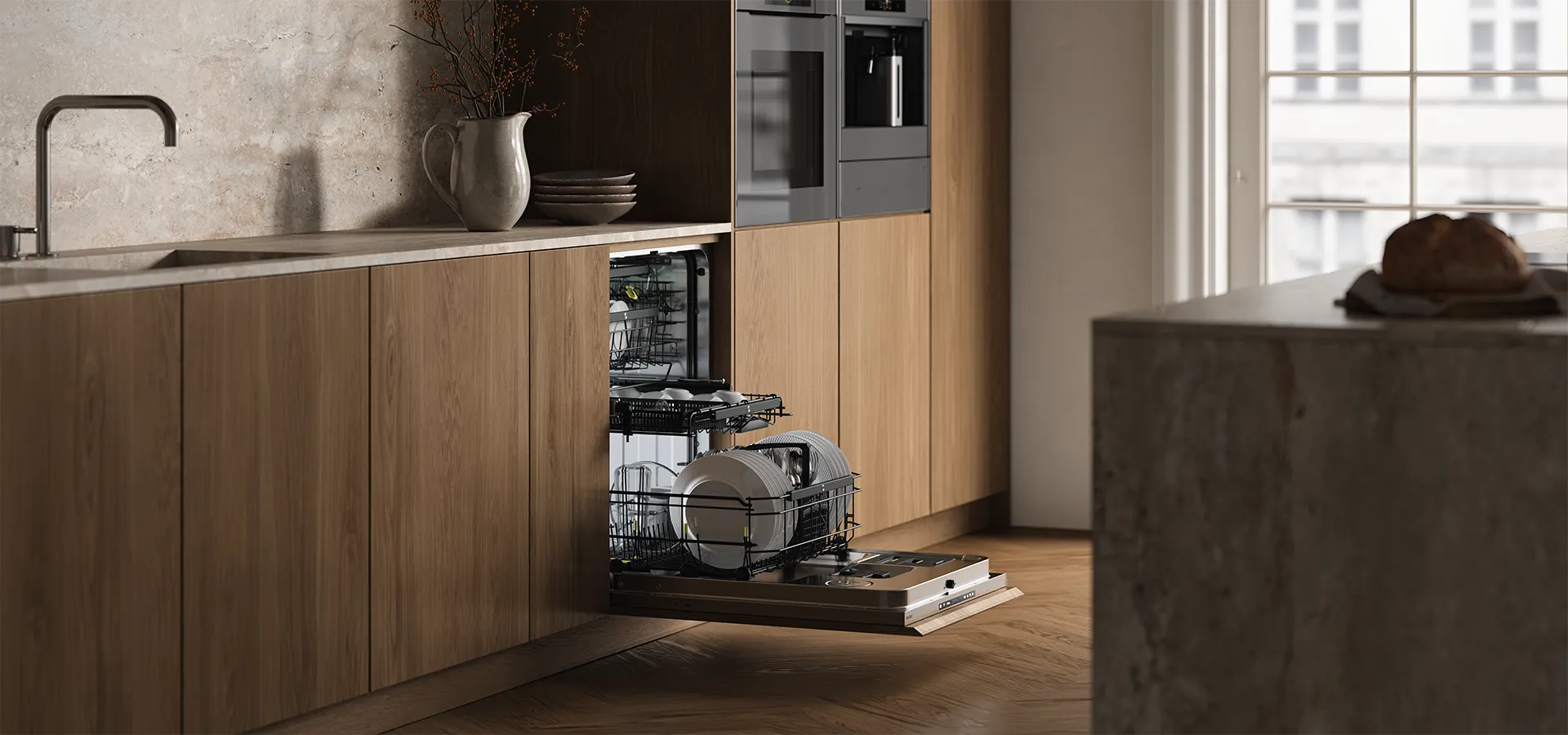 ASKO integrated dishwasher open in a Scandinavian-style kitchen with oak cabinetry, built-in oven and coffee machine. ASKO integrated dishwasher open in a Scandinavian-style kitchen with oak cabinetry, built-in oven and coffee machine.