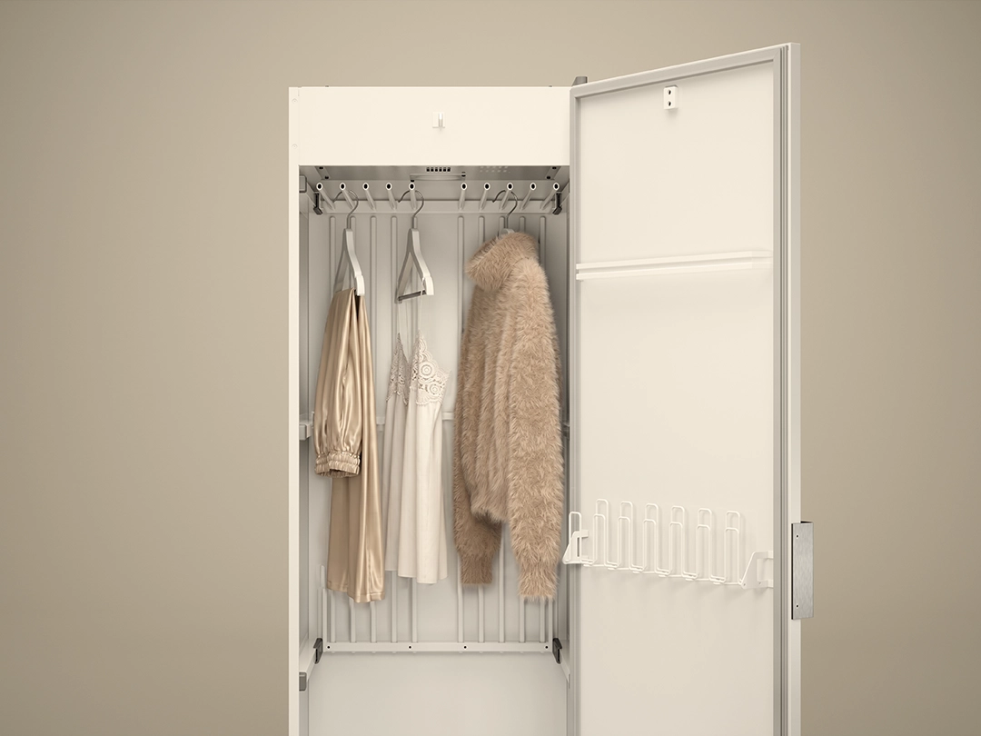 Open ASKO drying cabinet with hanging delicate garments and knitwear, providing gentle drying and care for sensitive fabrics. Open ASKO drying cabinet with hanging delicate garments and knitwear, providing gentle drying and care for sensitive fabrics.