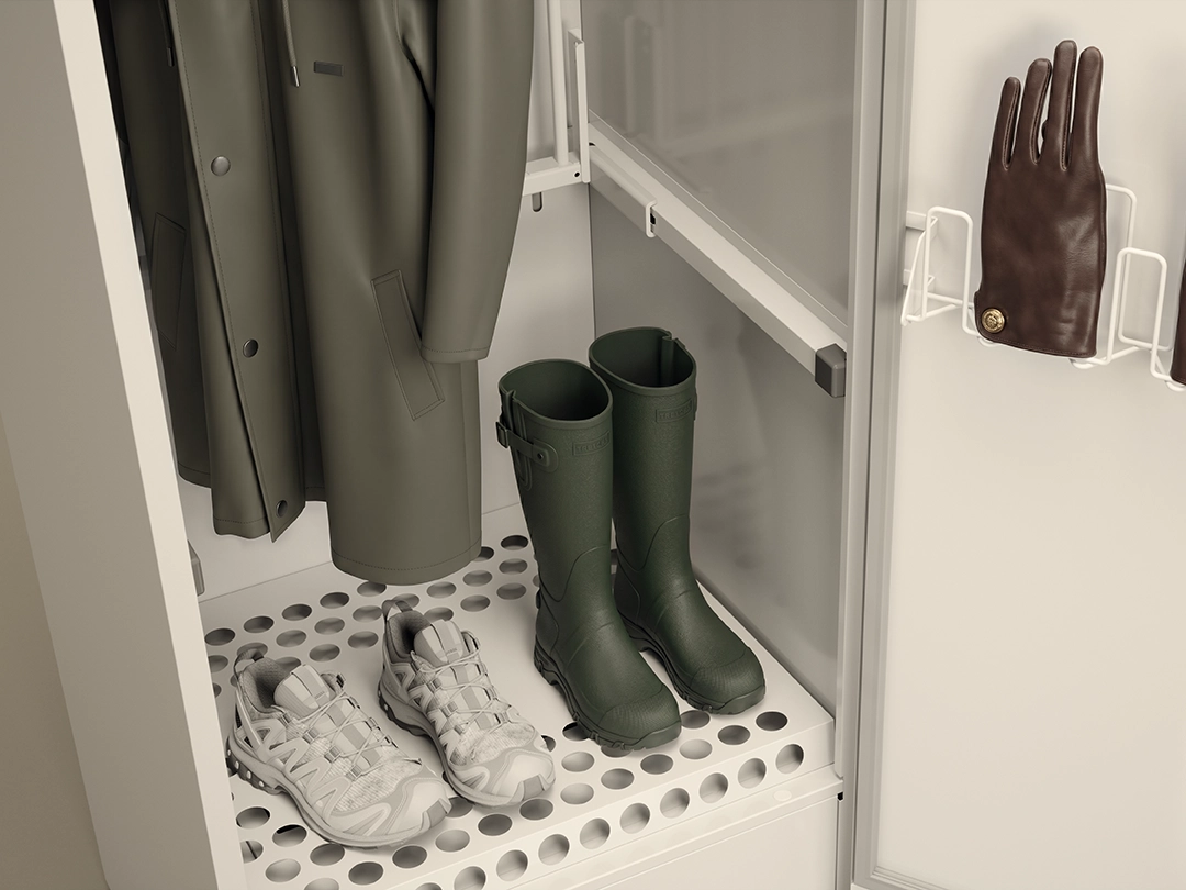 Interior of an ASKO drying cabinet with waterproof jacket, rubber boots, trainers and glove holders, designed for drying outdoor clothing and footwear. Interior of an ASKO drying cabinet with waterproof jacket, rubber boots, trainers and glove holders, designed for drying outdoor clothing and footwear.