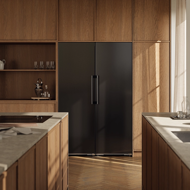ASKO black steel refrigerator and freezer integrated into a light wood kitchen. ASKO black steel refrigerator and freezer integrated into a light wood kitchen.