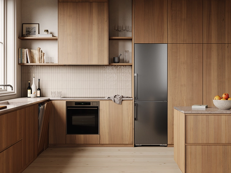 Modern kitchen featuring ASKO cooling and cooking appliances in a warm wood interior Modern kitchen featuring ASKO cooling and cooking appliances in a warm wood interior