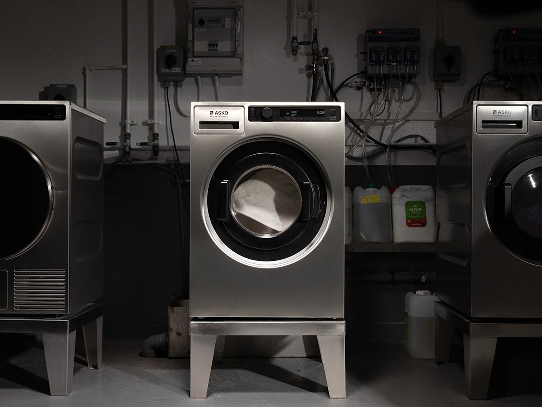 ASKO Professional washing machine in a commercial laundry room