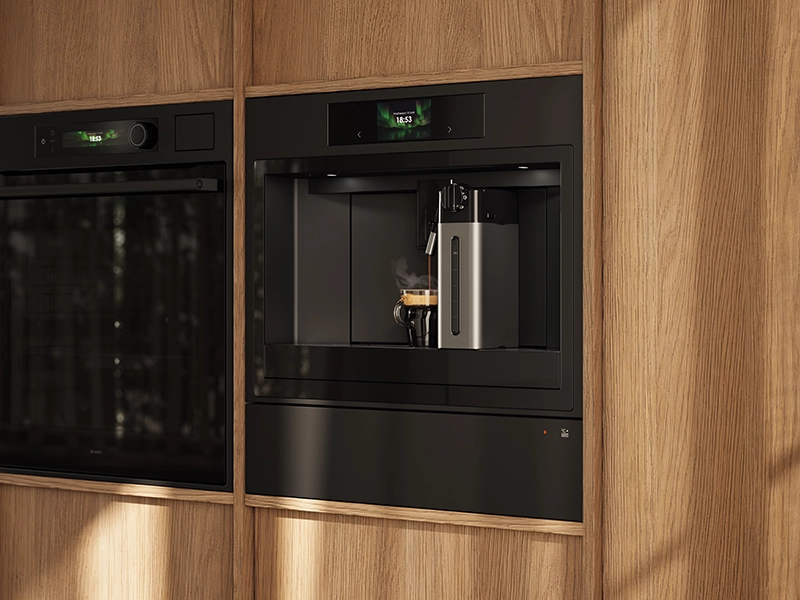 Integrated warming drawer beneath a built-in coffee machine in a wooden kitchen